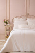 White duvet and sham set with pleated, ruffled edges