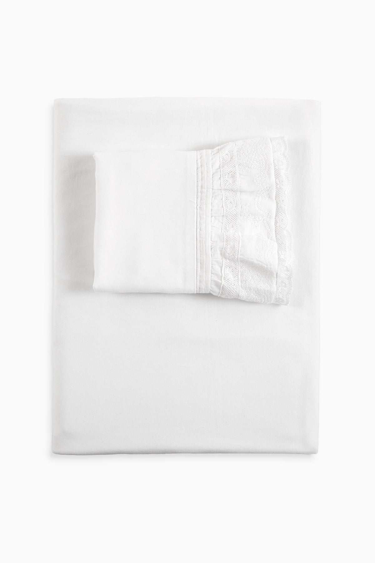 White sheet and pillowcase set with subtle embossed fabric pattern