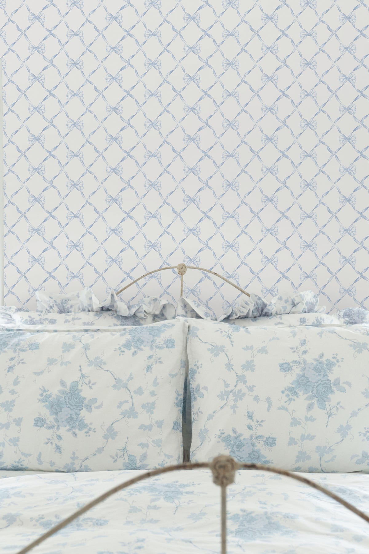 Blue ribbon bow trellis wallpaper pattern with repeating lattice design.