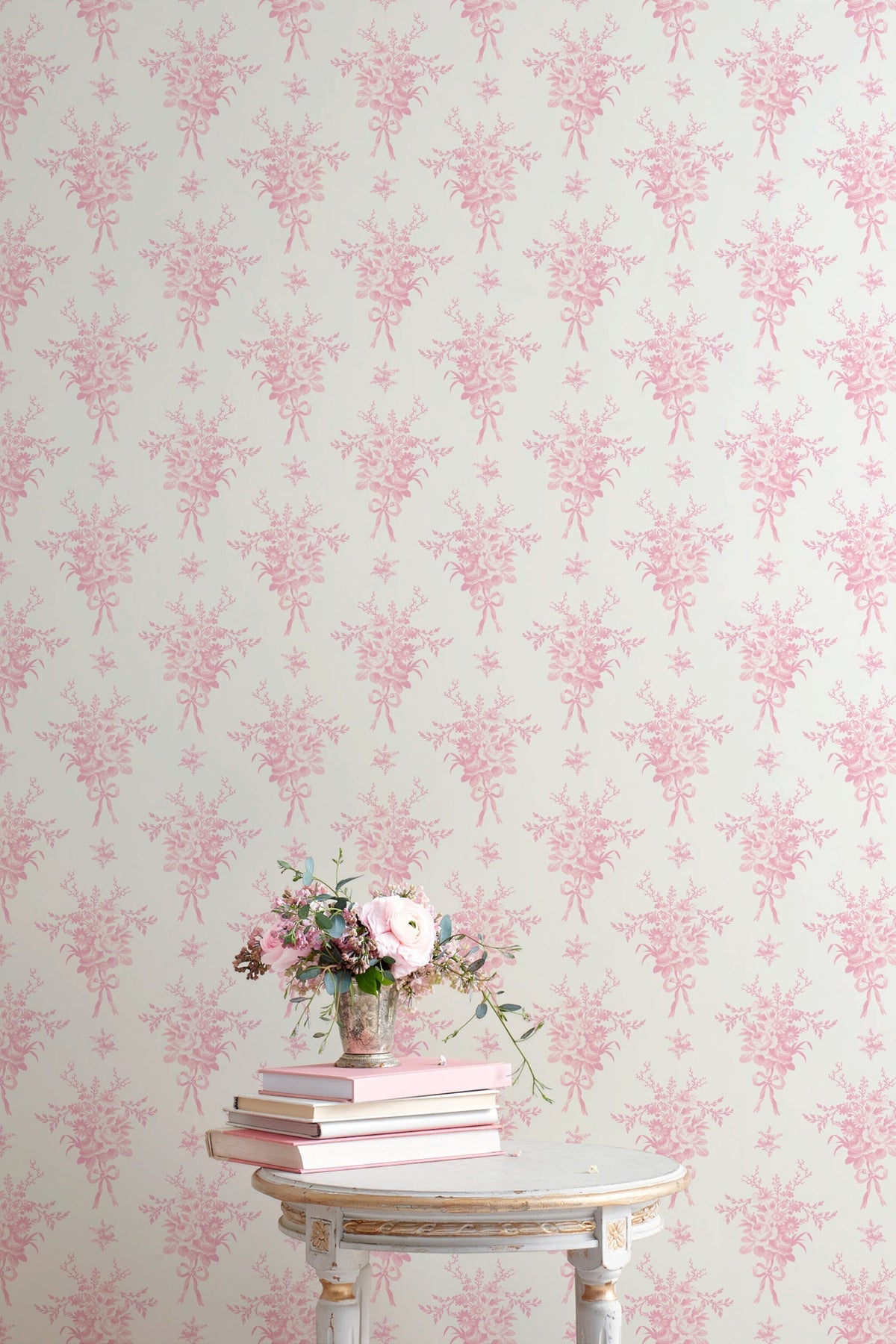 Light background wallpaper with repeating pink small floral bouquet silhouettes
