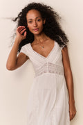 White midi dress with V-neck lace bodice, textured embroidery, short puff sleeves