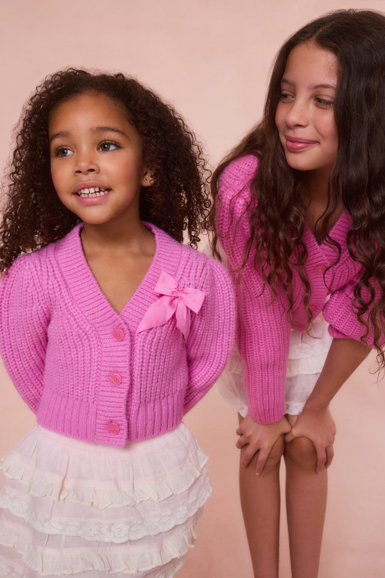 Girls pink alpaca bow button cardigan with chest bow and ribbed trim