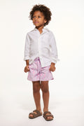 Pink allover print boys swim shorts with elastic waist and drawstring.