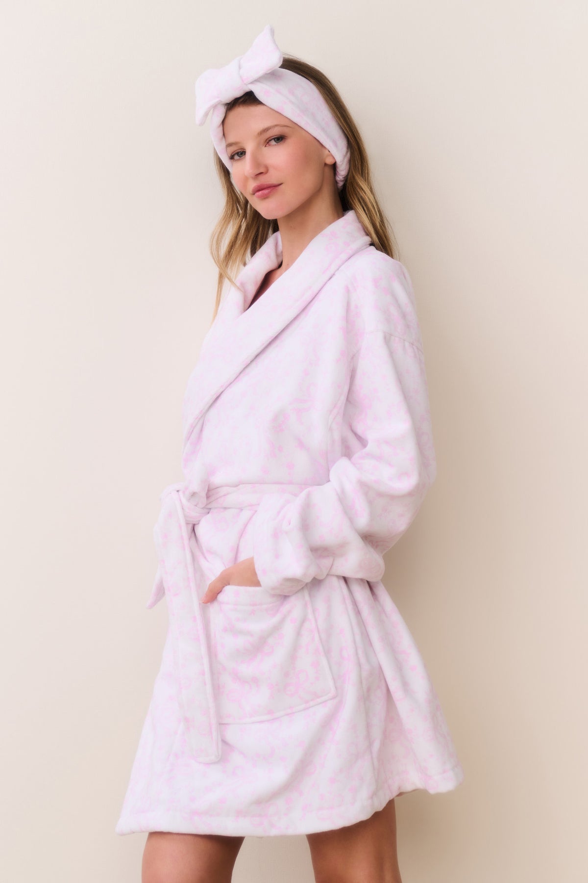 Light pink cotton bath robe with small bow print, tie belt and knotted hood
