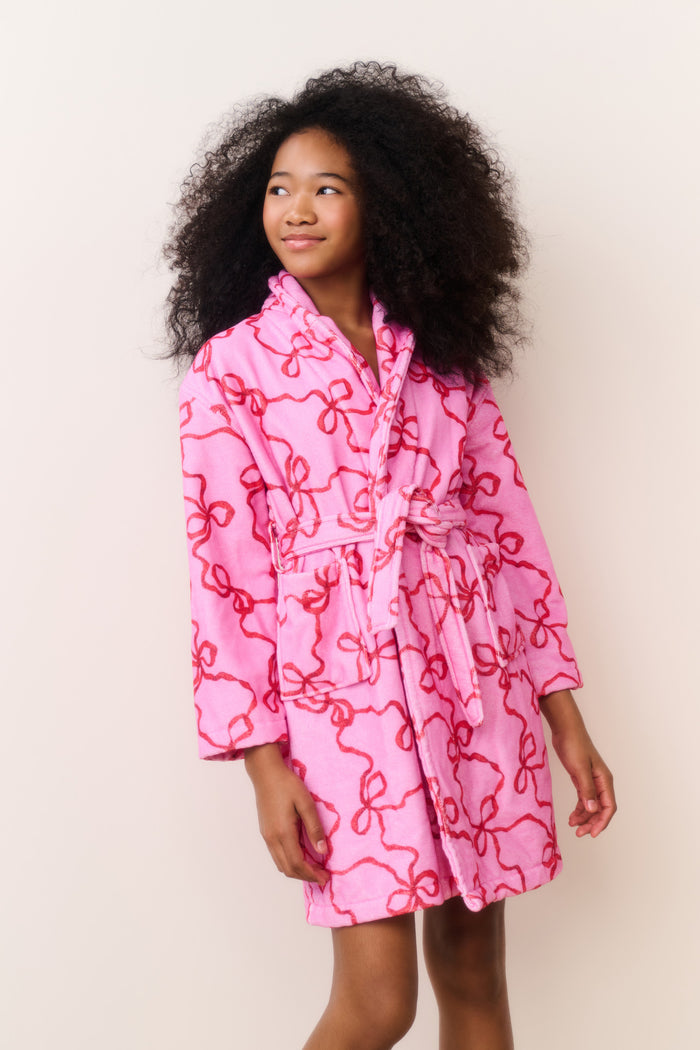 Kids hooded robe in pink with allover bow-like pattern and belt tie