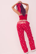 Red pajama pants with allover heart graphic, drawstring tie waist, straight flannel legs