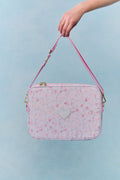 Floral laptop case with heart front, pink piping, and detachable shoulder strap