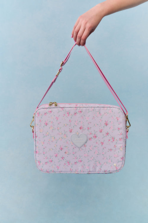Floral laptop case with heart front, pink piping, and detachable shoulder strap