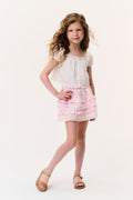 Girls light pink tiered ruffle mini skirt, front view