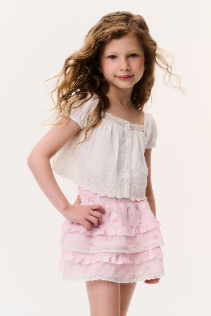 Girls light pink tiered ruffle mini skirt with delicate texture