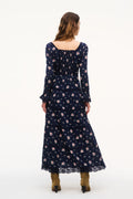 Navy floral maxi dress back view with long sleeves and tiered hem