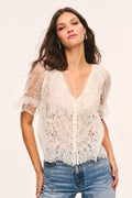 Sheer lace top with V-neck and short sleeves, embroidered lace details, alabaster