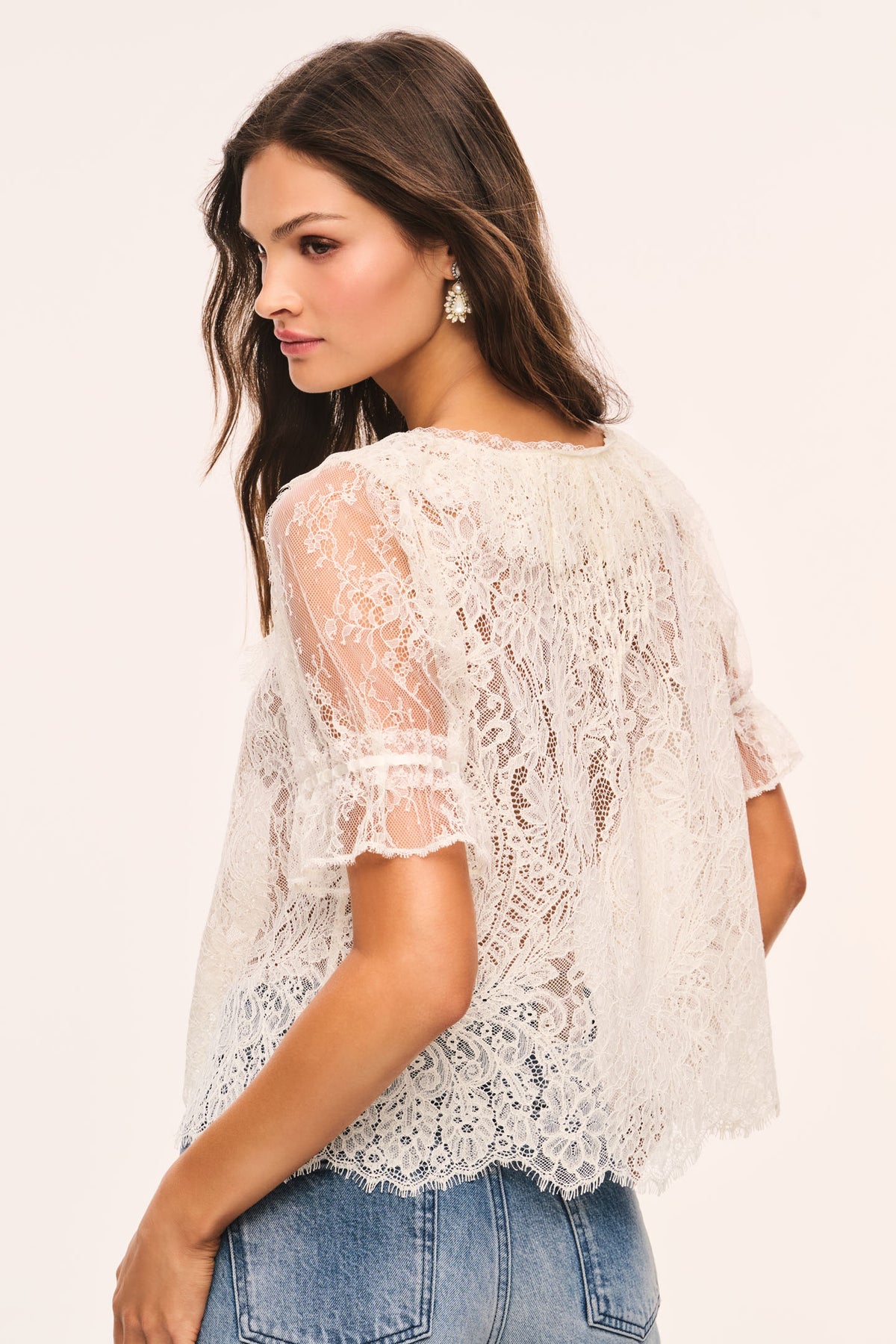 Sheer lace top with V-neck front and detailed lace back, alabaster