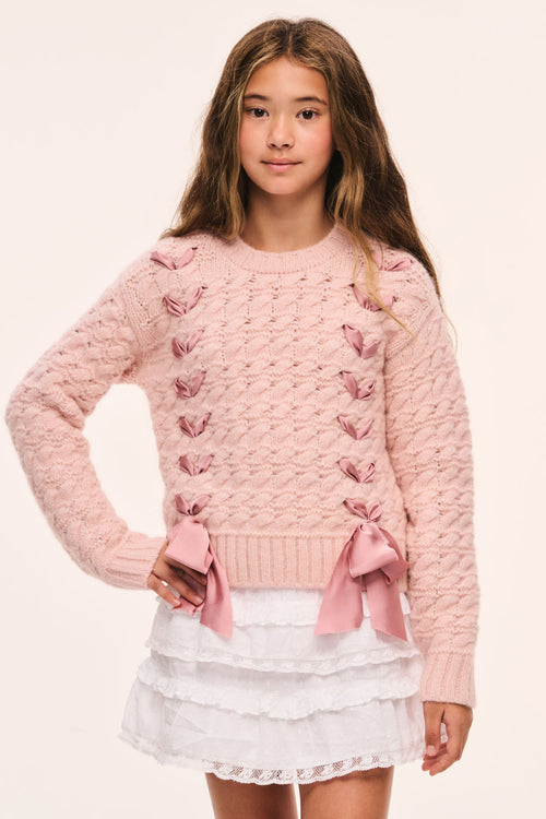 Tween pink textured knit pullover front view with ribbon threaded through and bow at hem