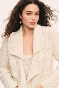 Windel ivory cardigan close-up:  ivory textured knit cardigan, open front with shawl collar, ribbon laced through the front