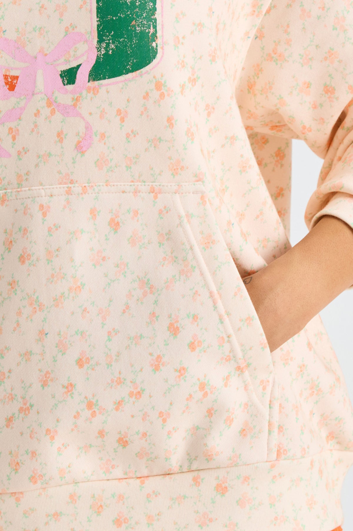 Pink floral-print hoodie with kangaroo pocket seam and long puff sleeve cuff detail