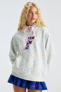 Light blue speckle hoodie with hood and drawstring, front logo graphic, layered skirt hem