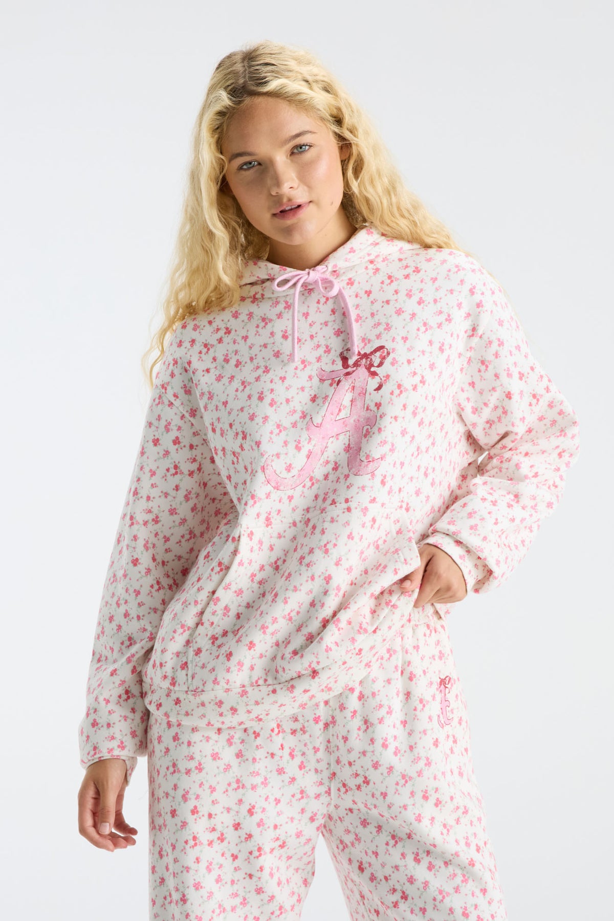 Pink floral-print hoodie with hood, pink drawstring, long sleeves, and kangaroo pocket
