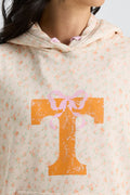 Cream floral hoodie close-up of hood and drawstring with orange graphic cross