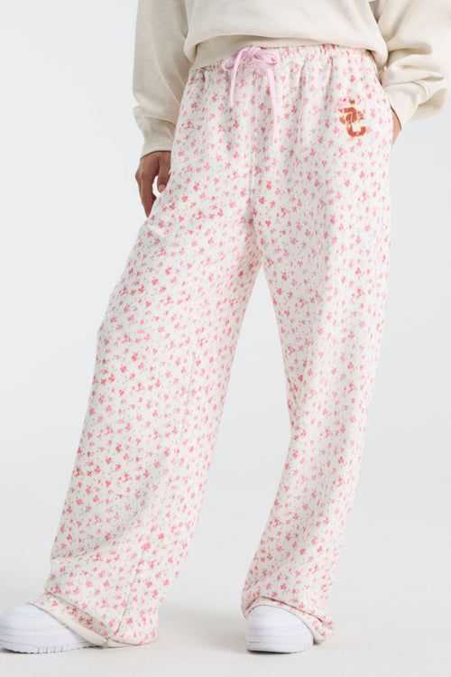 Pink ditsy floral sweatpants with elastic waist and pink drawstring, relaxed wide legs