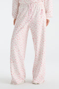 Cream sweatpants with pink floral print and drawstring waist, full leg view