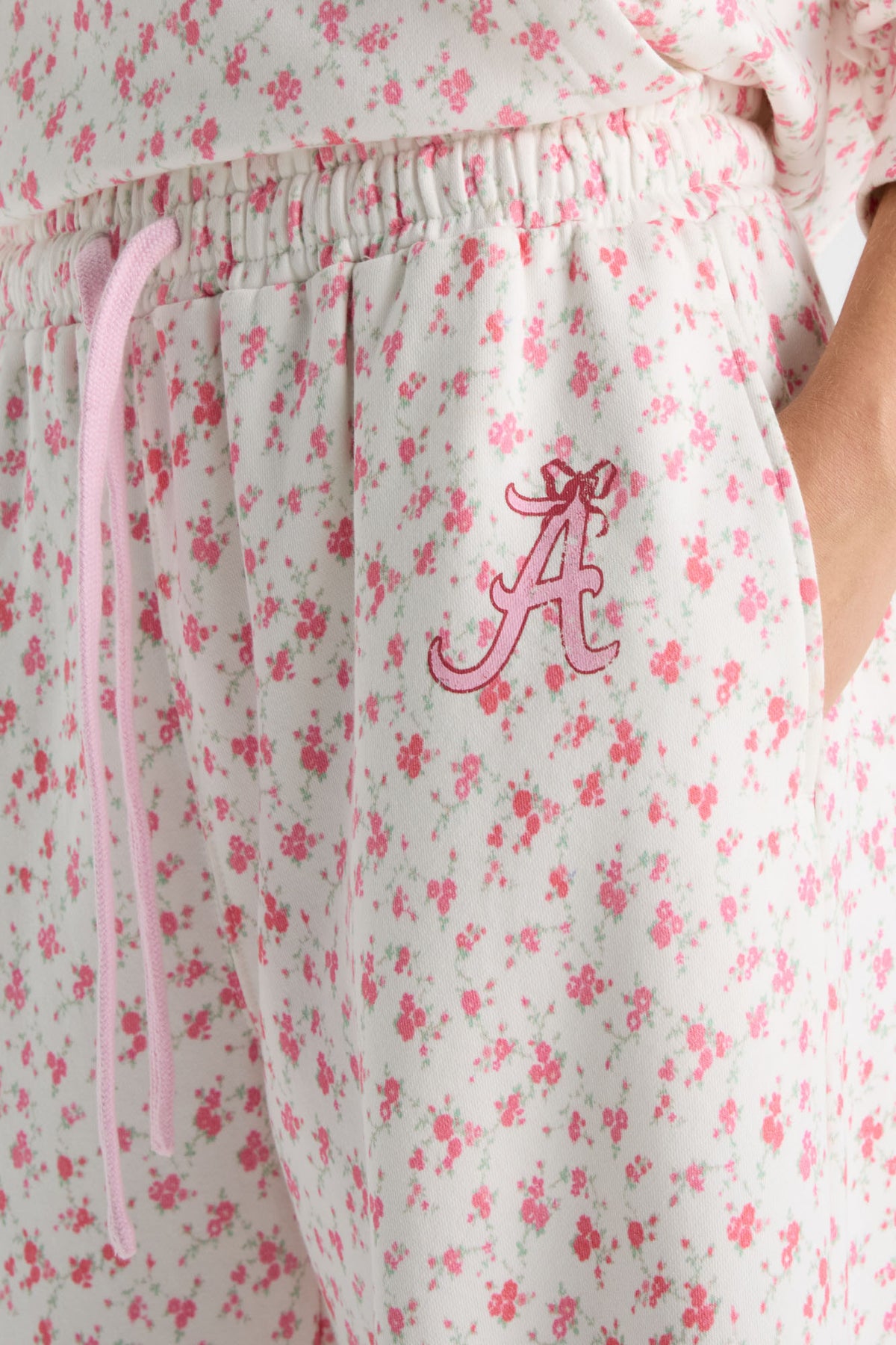 Floral sweatpants with elastic waistband and embroidered A logo on the thigh