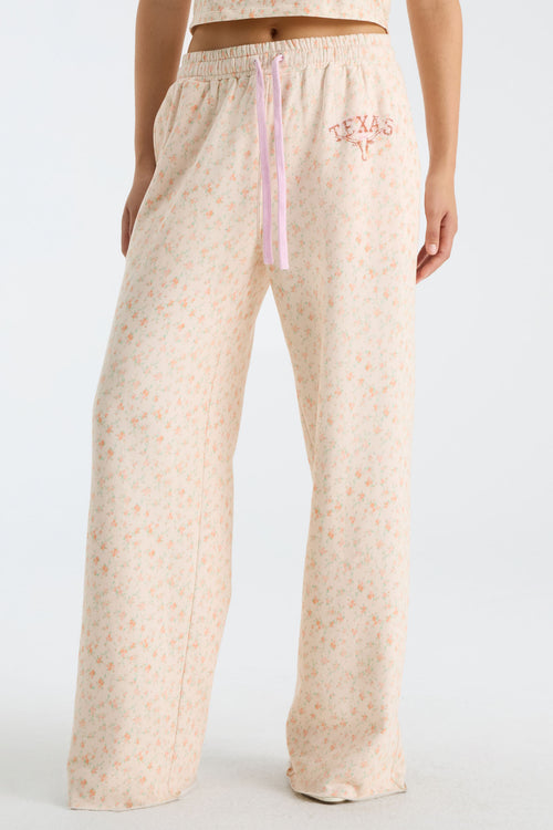 Front view of women’s wide-leg sweatpants with elastic waist and pink drawstring