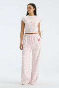 Women’s floral sweatpants with wide legs, elastic waist, and pink drawstring detail