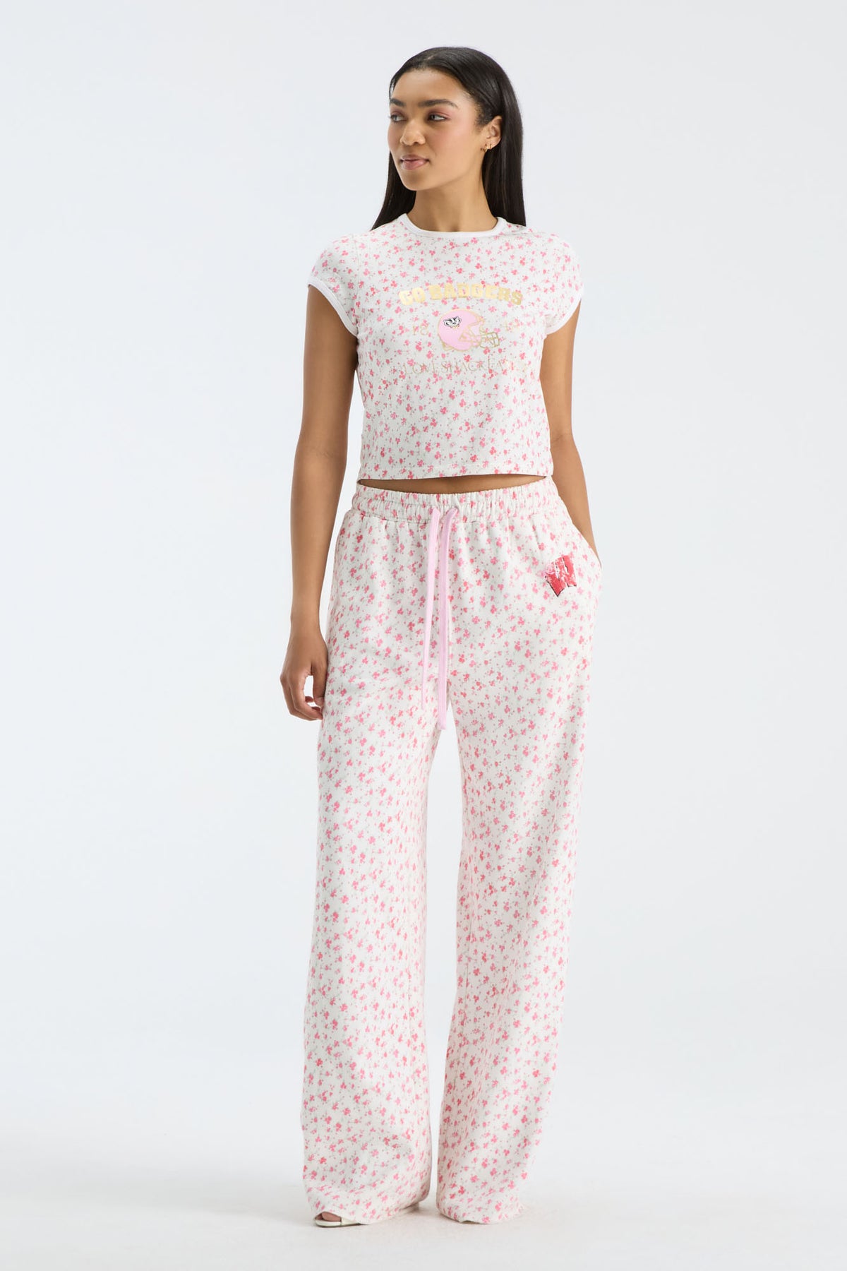 Women’s floral sweatpants with wide legs, elastic waist, and pink drawstring detail