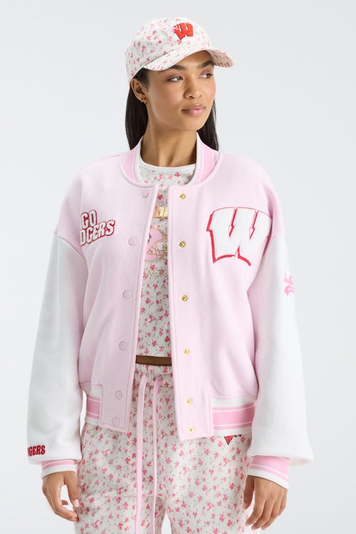Pink floral baseball cap with small red print and matching varsity-style jacket