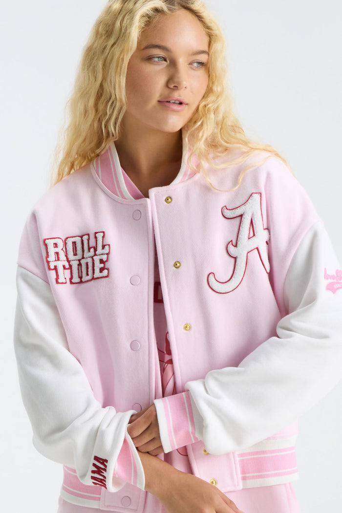 Pink varsity jacket with embroidered “Roll Tide” patch, striped ribbed cuffs, button front