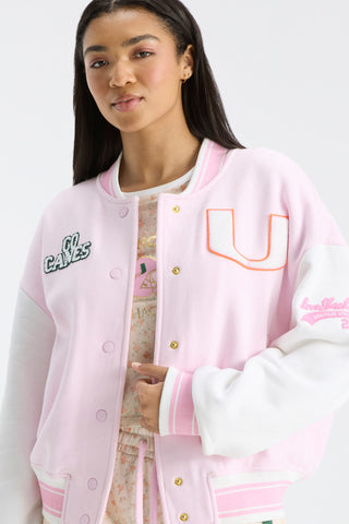 Pink varsity jacket with snap front, ribbed cuffs and hem, U logo and sleeve embroidery