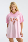 Pink V-neck jersey dress with Texas text and longhorn logo, front view