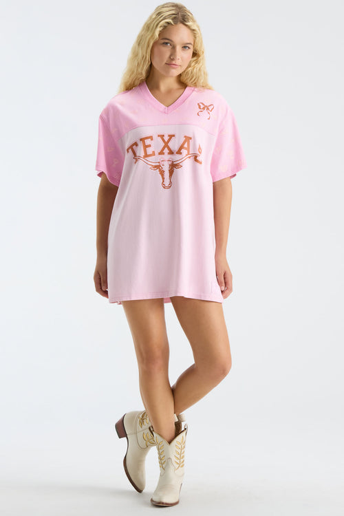 Pink V-neck jersey dress with Texas text and longhorn logo, full body view