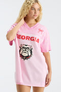 Pink varsity jersey dress with Georgia text and bulldog mascot graphic, side view