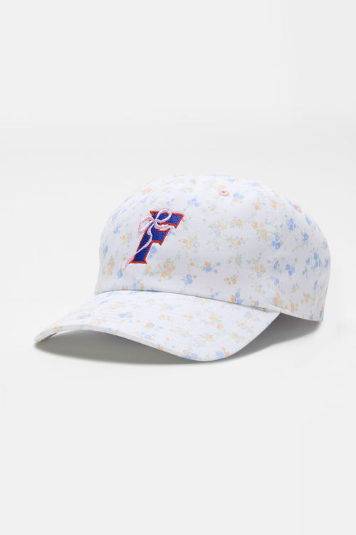 White floral baseball cap with blue-and-red team logo