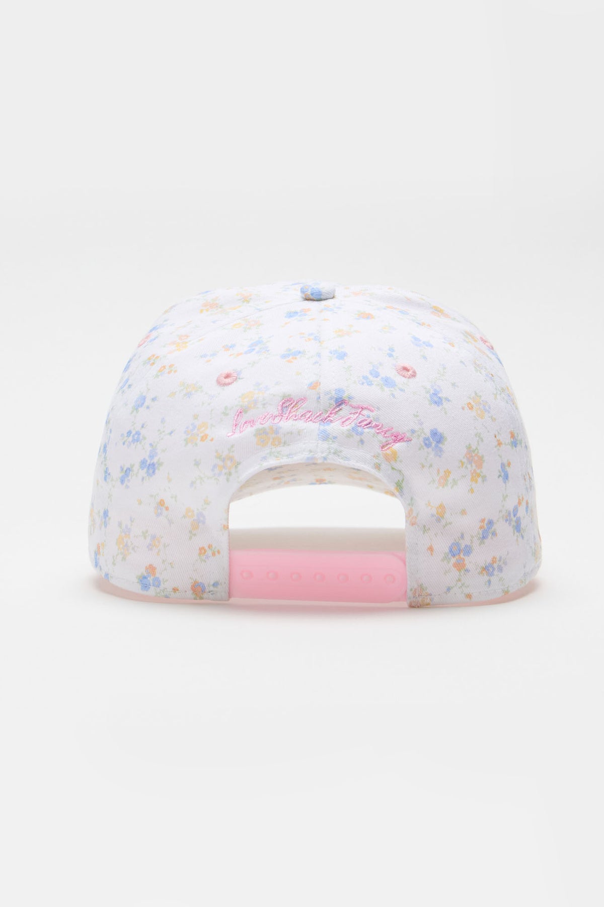 White floral baseball cap with pink cursive logo