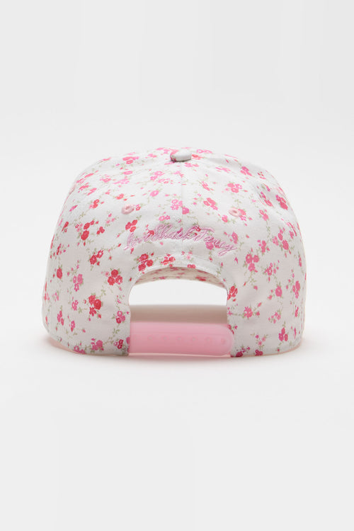 Pink baseball cap with small scattered floral pattern and open mesh back panel