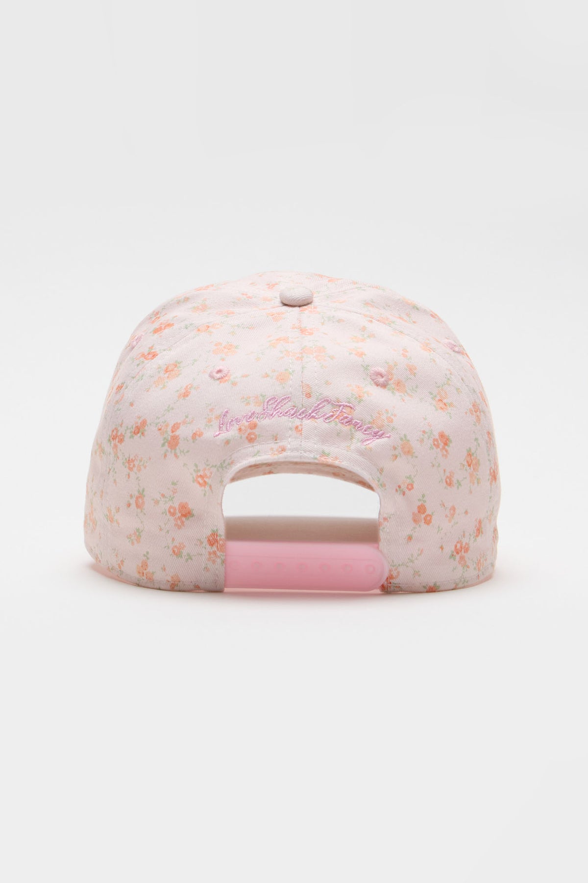 Light pink floral baseball cap with front cursive logo text