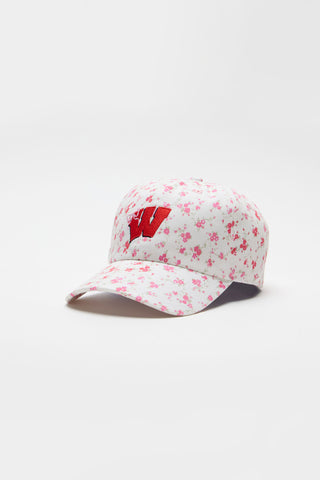 Pink baseball cap with scattered floral pattern and red letter logo on the front