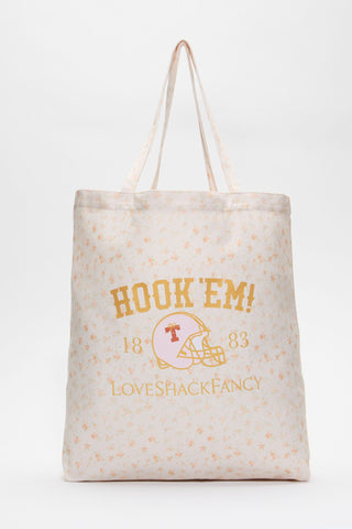 Light tan tote bag with Hook ’Em lettering and football logo, long handles