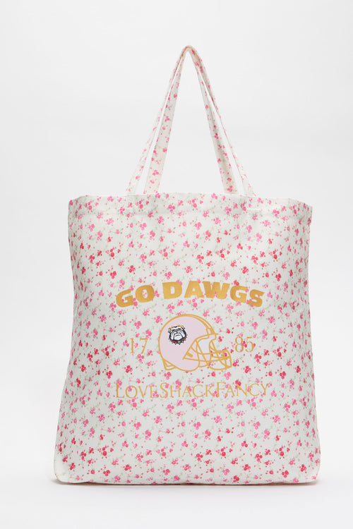 White tote bag with pink floral pattern and large printed logo graphic