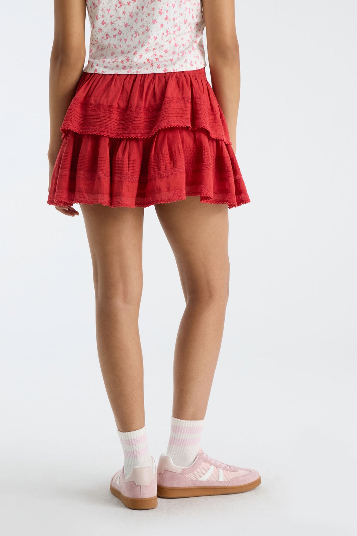 Ruffle mini skirt in dark red with tiered flounces and elastic waistband
