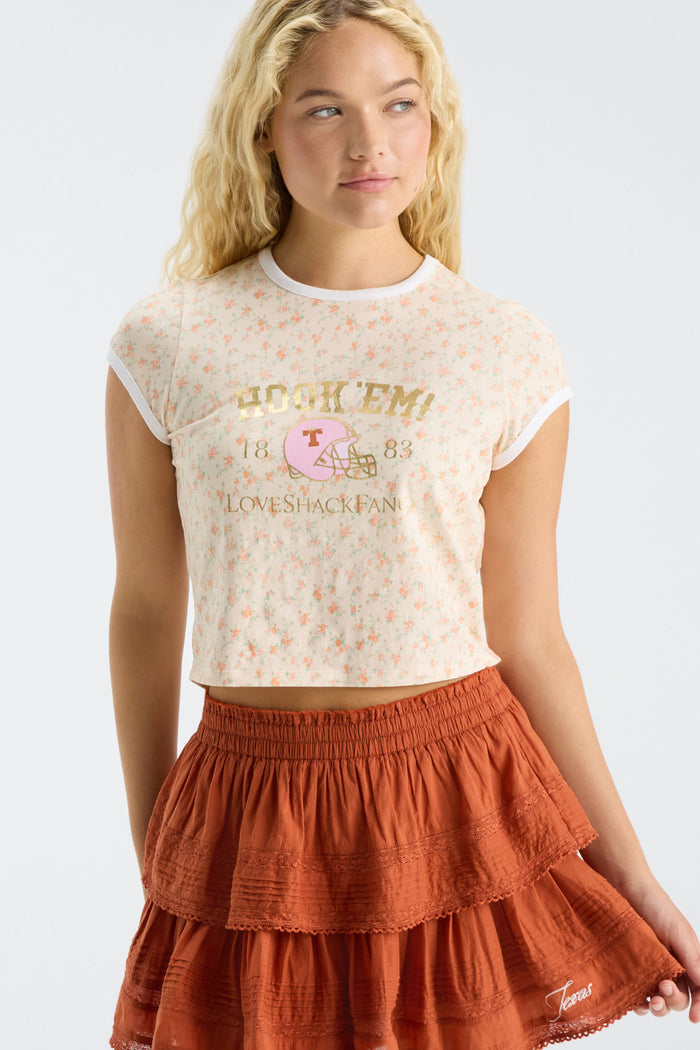 Burnt orange tiered ruffle mini skirt with elastic waistband and lace-trim edge.