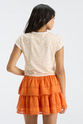 Fanatics x LoveShackFancy floral ringer tee back view with layered orange hem visible at waist