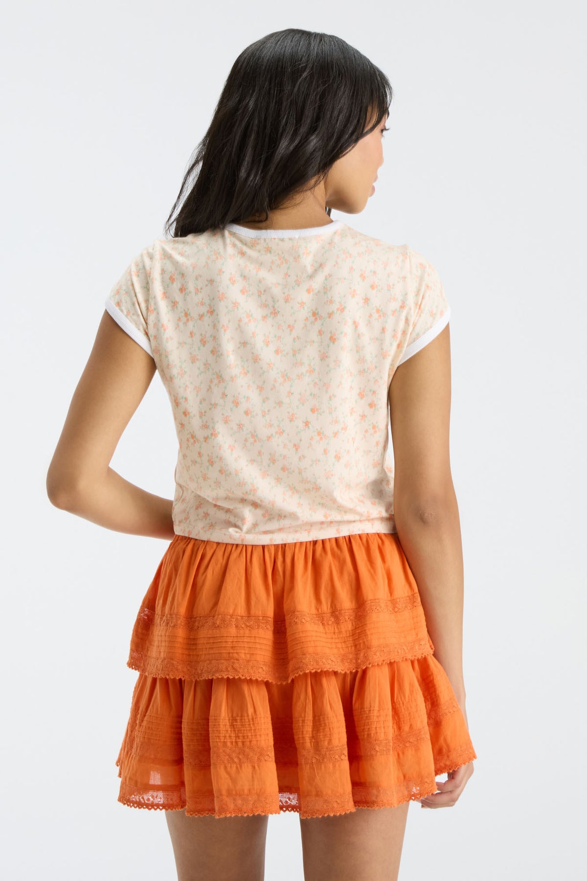 Fanatics x LoveShackFancy floral ringer tee back view with layered orange hem visible at waist