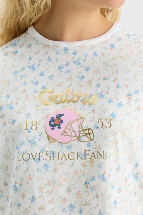 Light blue graphic ringer tee with gold Gators text and helmet front print
