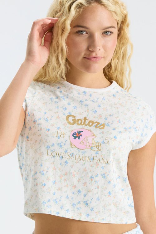 Light blue speckled ringer tee close-up with gold Gators logo