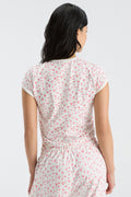 Women’s cropped ringer tee with pink floral print, short sleeves, crew neck