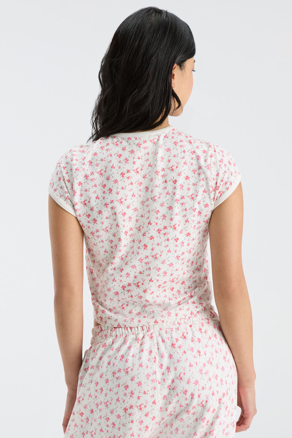 Women’s cropped ringer tee with pink floral print, short sleeves, crew neck